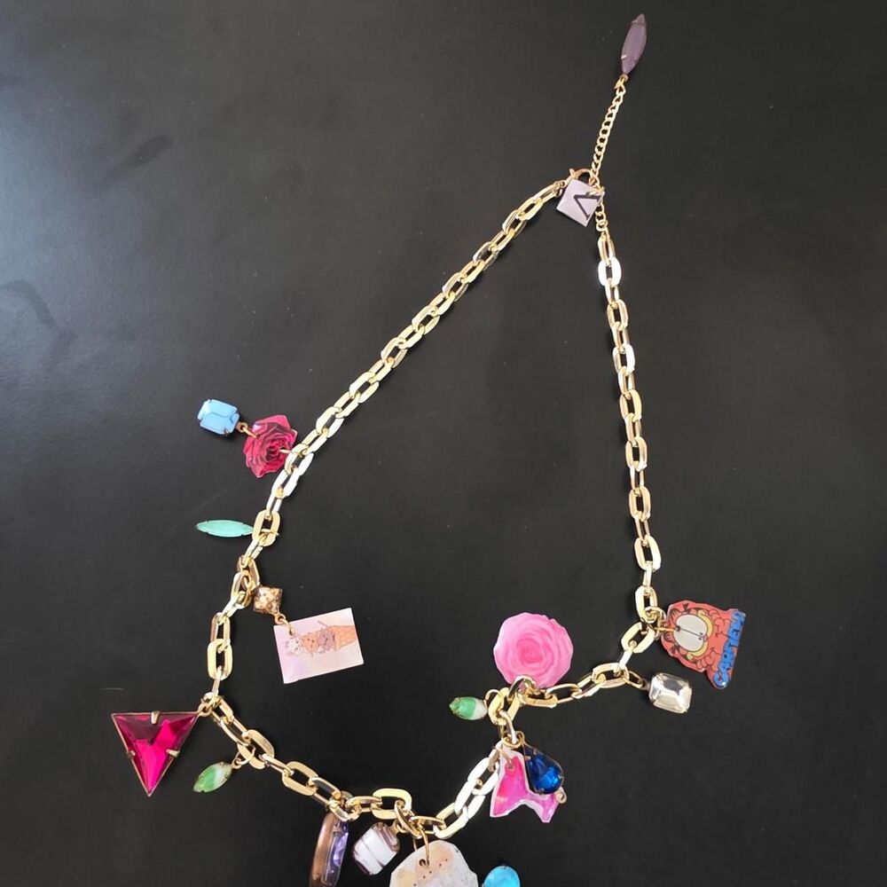 Plastic gold chain necklace with many different charms